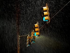 four traffic lights in rain