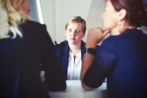 Three executives at a meeting